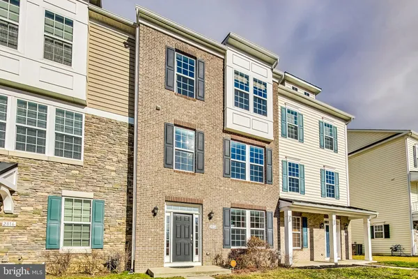 a front view of a building with a street