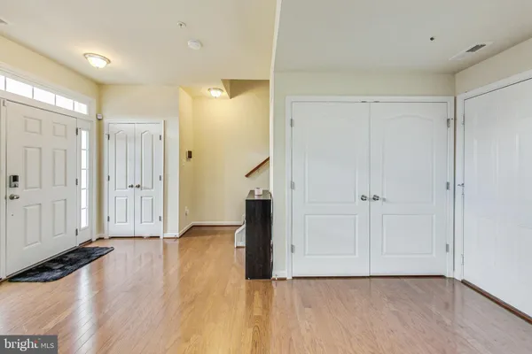 a view of entryway with wooden floor