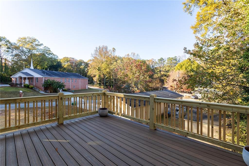 3156 Zion Street Scottdale, GA 30079 - Photo 14 of 40 a view of a balcony with wooden floor and fence
