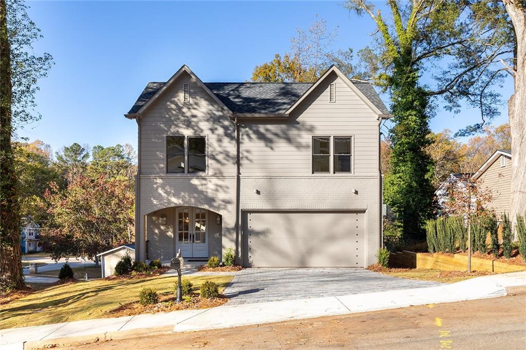 3156 Zion Street Scottdale, GA 30079 - Photo 2 of 40 a view of a house with snow on the background