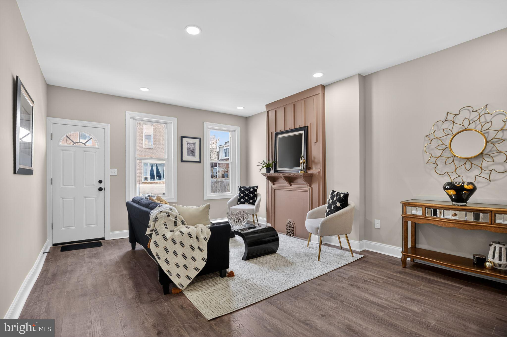 a living room with furniture and a flat screen tv