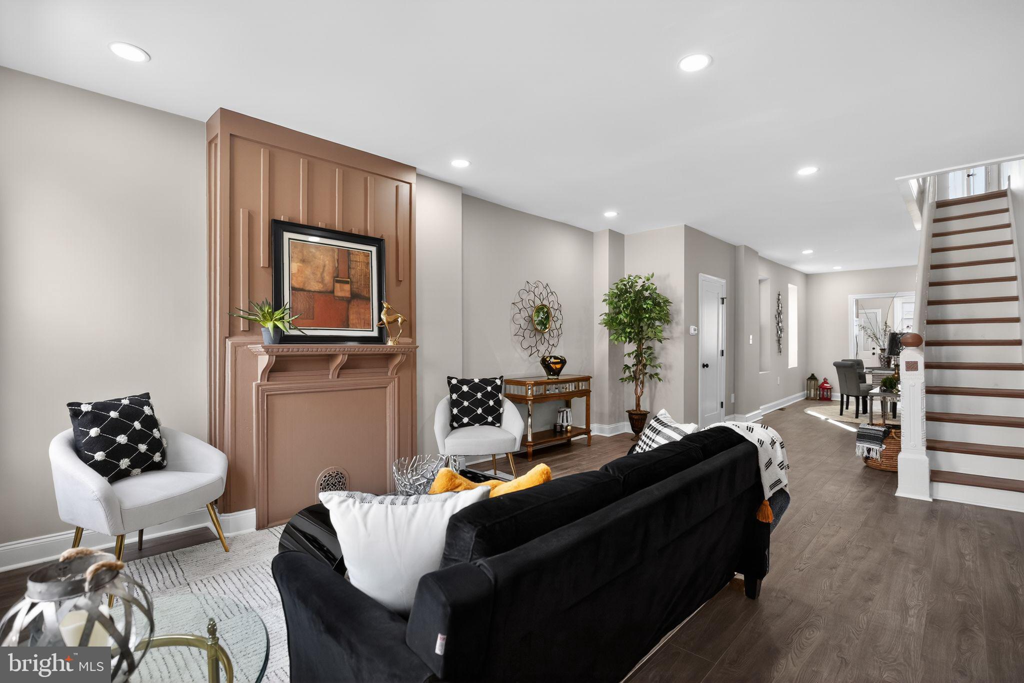 2014 Moore Street Philadelphia, PA 19145 - Photo 2 of 26 a living room with furniture and a chandelier
