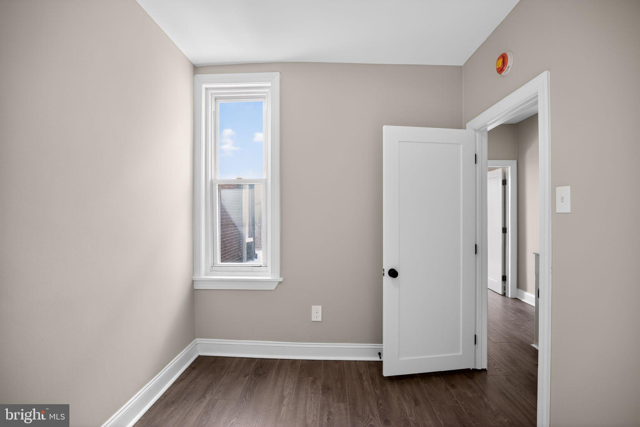 2014 Moore Street Philadelphia, PA 19145 - Photo 21 of 26 a view of room with window and hardwood floor