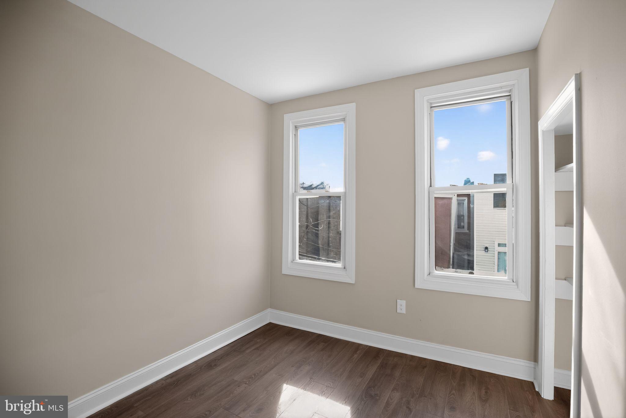 2014 Moore Street Philadelphia, PA 19145 - Photo 22 of 26 a view of an empty room with wooden floor and a window