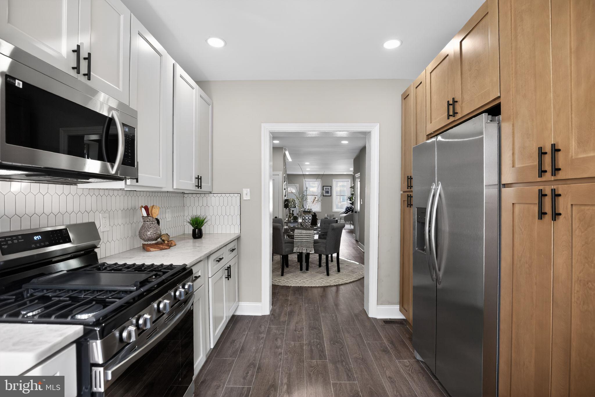 2014 Moore Street Philadelphia, PA 19145 - Photo 9 of 26 a kitchen with stainless steel appliances a stove a sink and a refrigerator