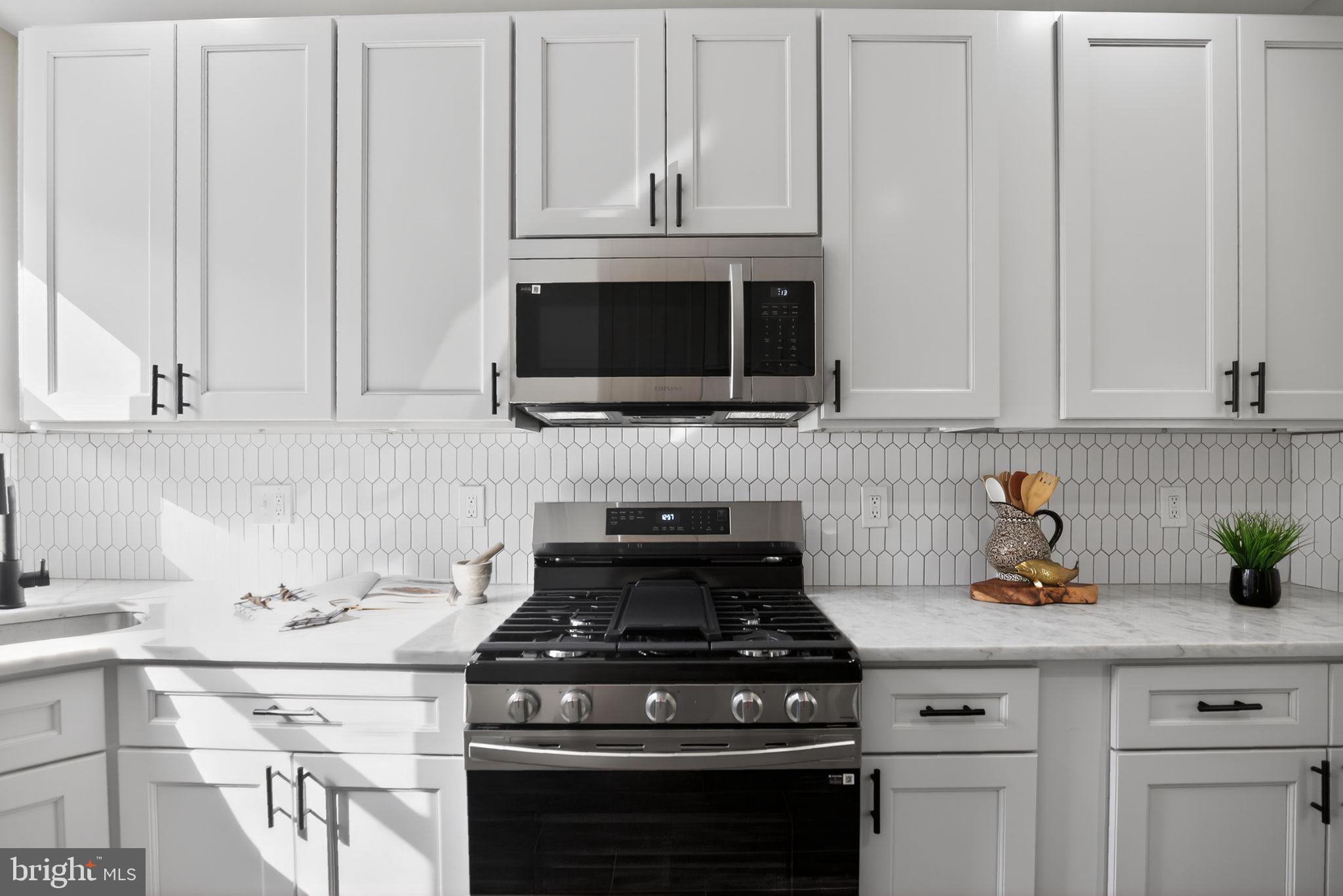 2014 Moore Street Philadelphia, PA 19145 - Photo 10 of 26 a stove top oven sitting inside of a kitchen