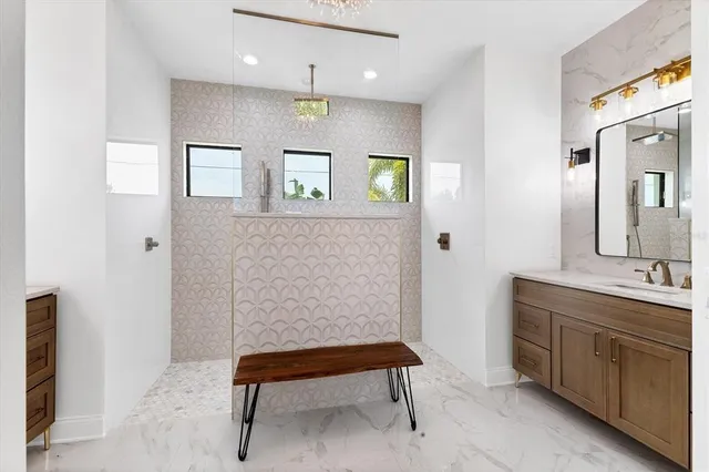 a bathroom with a sink a toilet and mirror