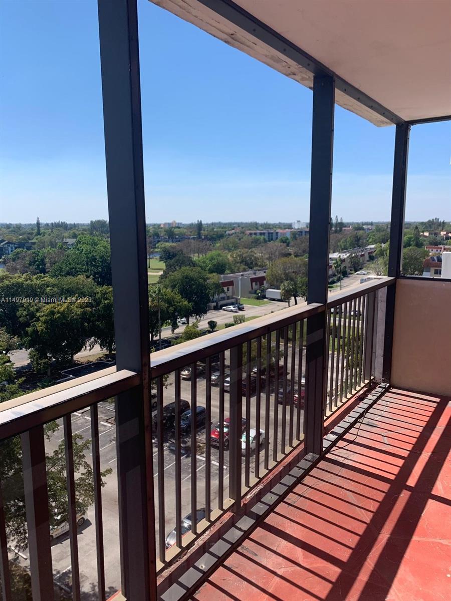 4174 Inverrary Drive, Unit 906 Lauderhill, FL 33319 - Photo 1 of 9 a view of a balcony with wooden floor