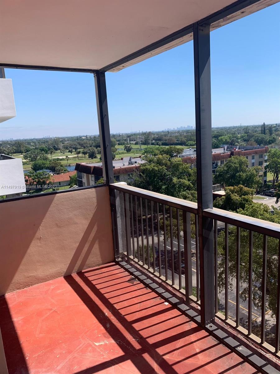4174 Inverrary Drive, Unit 906 Lauderhill, FL 33319 - Photo 2 of 9 a view of balcony with couches and wooden floor