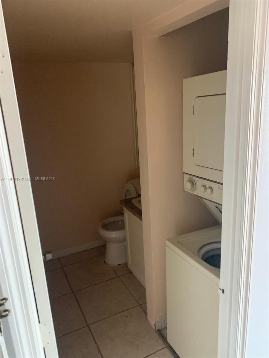 4174 Inverrary Drive, Unit 906 Lauderhill, FL 33319 - Photo 6 of 9 a bathroom with a sink and toilet