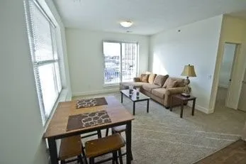 a living room with furniture and a window
