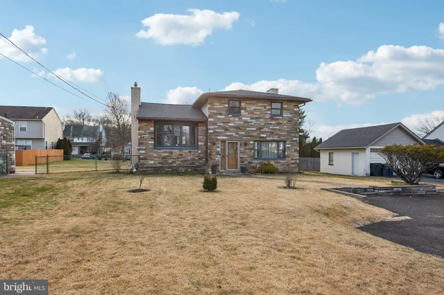 a view of a house with a snow in the yard