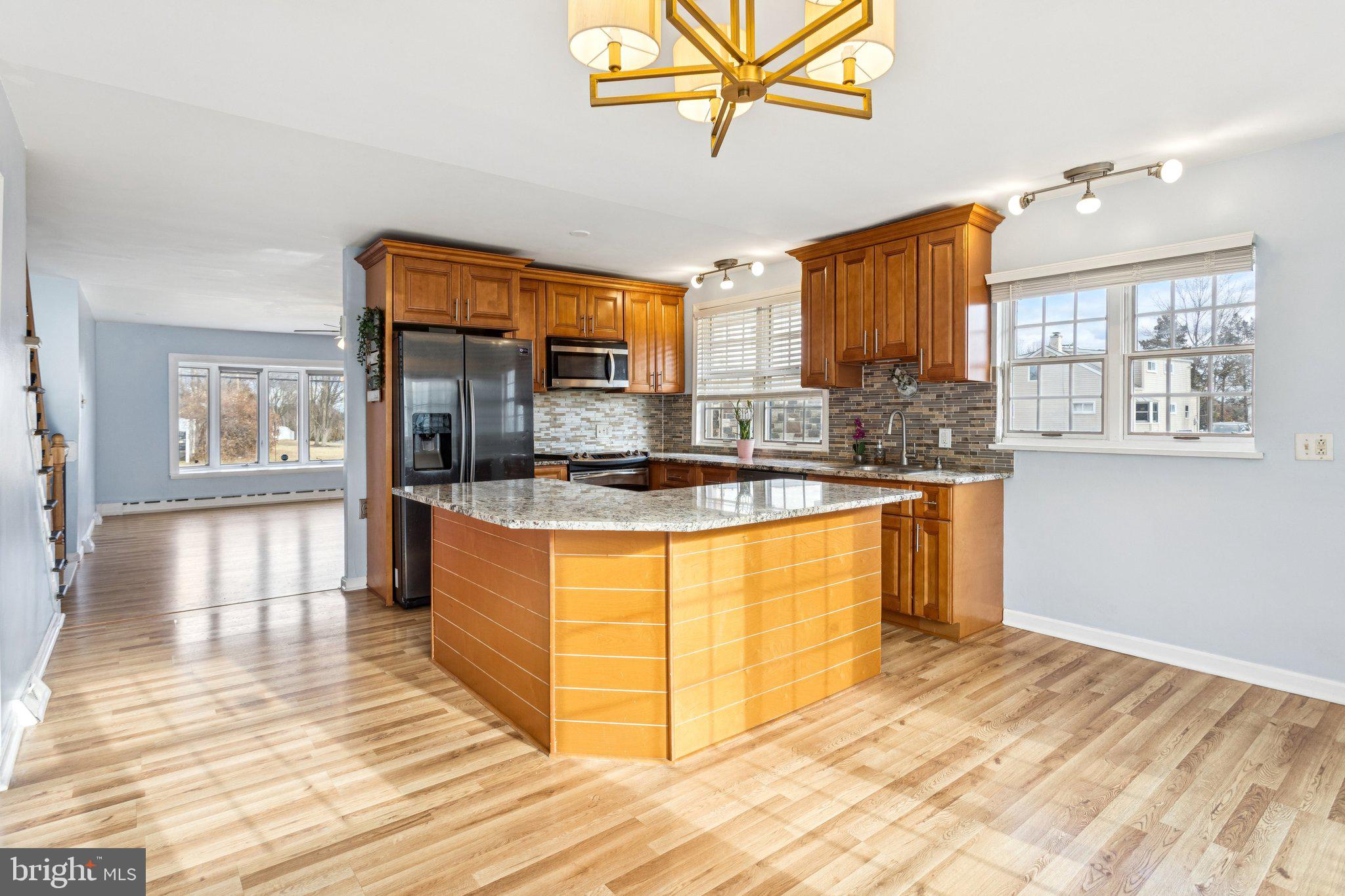 2614 Old Welsh Road Willow Grove, PA 19090 - Photo 11 of 47 a kitchen with stainless steel appliances granite countertop a stove a sink and a refrigerator