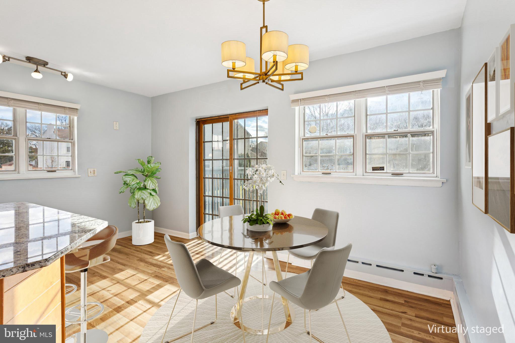 2614 Old Welsh Road Willow Grove, PA 19090 - Photo 12 of 47 a dining room with chandelier and wooden floor
