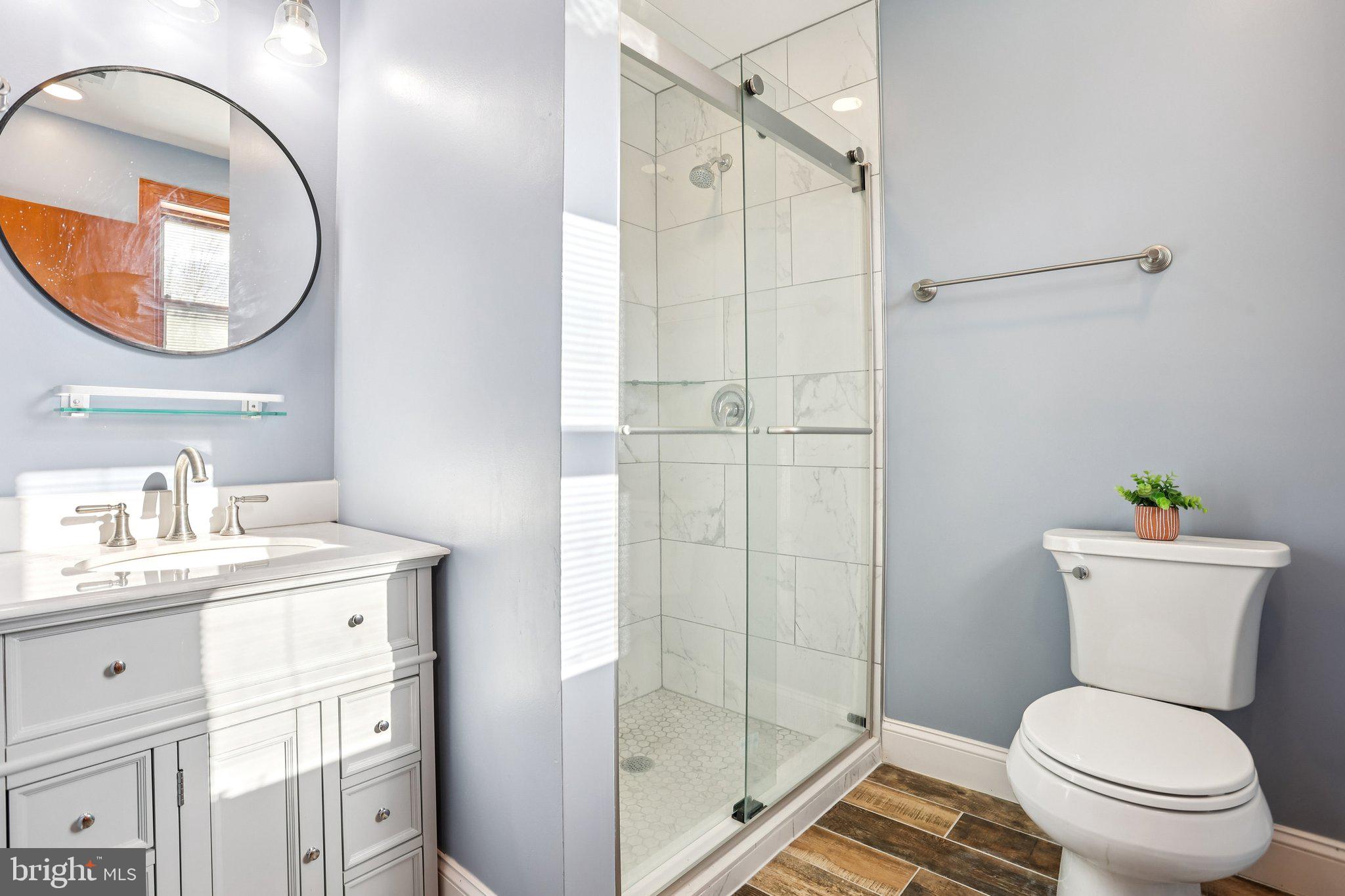 2614 Old Welsh Road Willow Grove, PA 19090 - Photo 17 of 47 a bathroom with a toilet a sink and a mirror