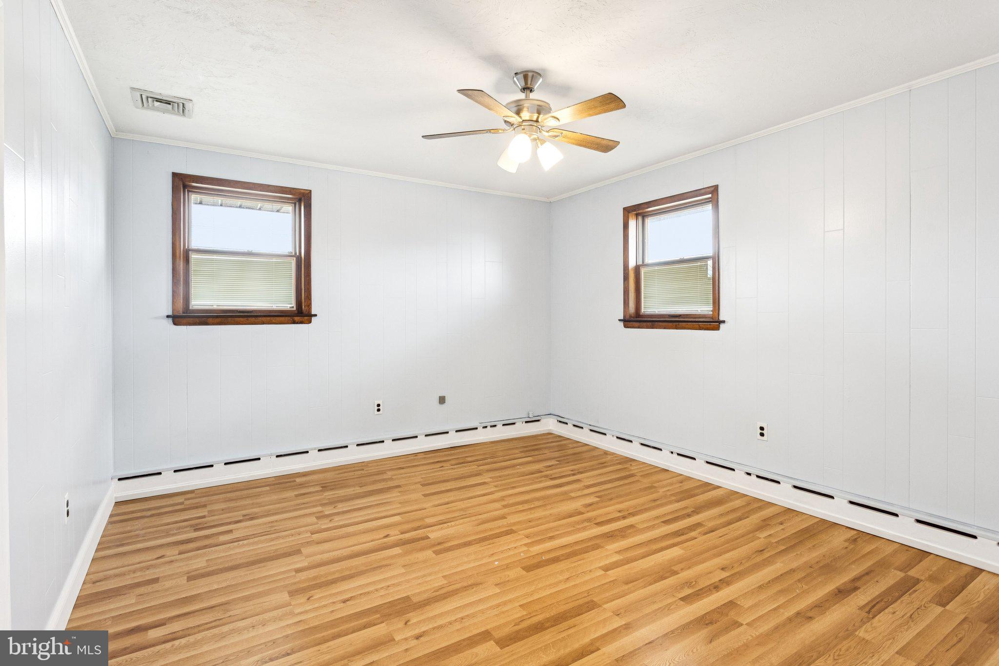 2614 Old Welsh Road Willow Grove, PA 19090 - Photo 20 of 47 a view of an empty room with chandelier fan and wooden floor