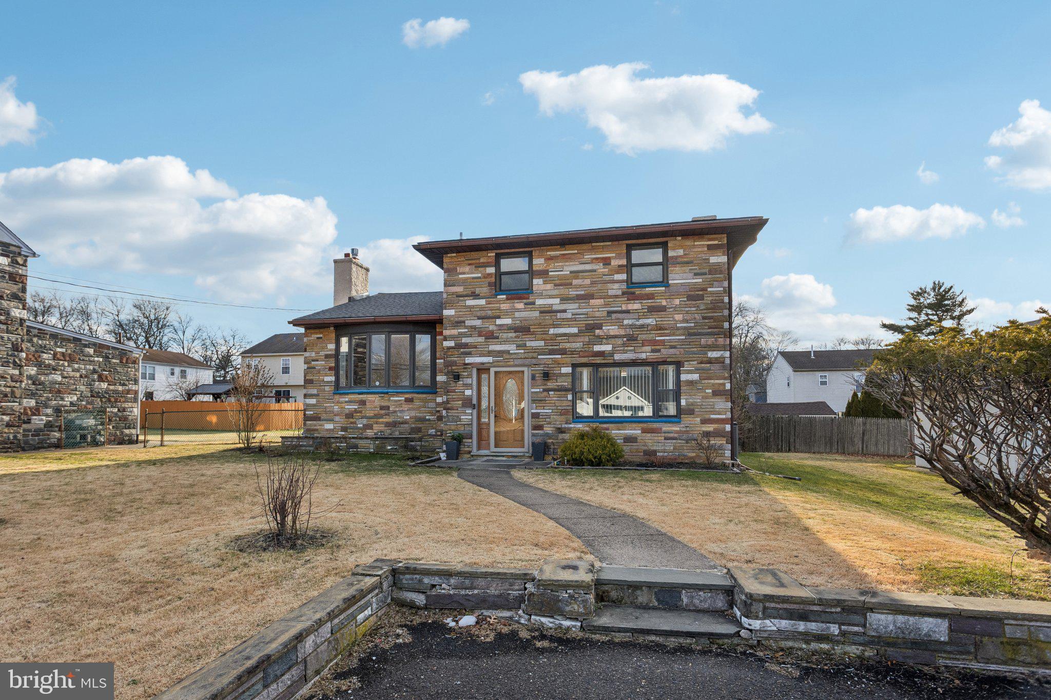2614 Old Welsh Road Willow Grove, PA 19090 - Photo 2 of 47 a front view of a house with a yard