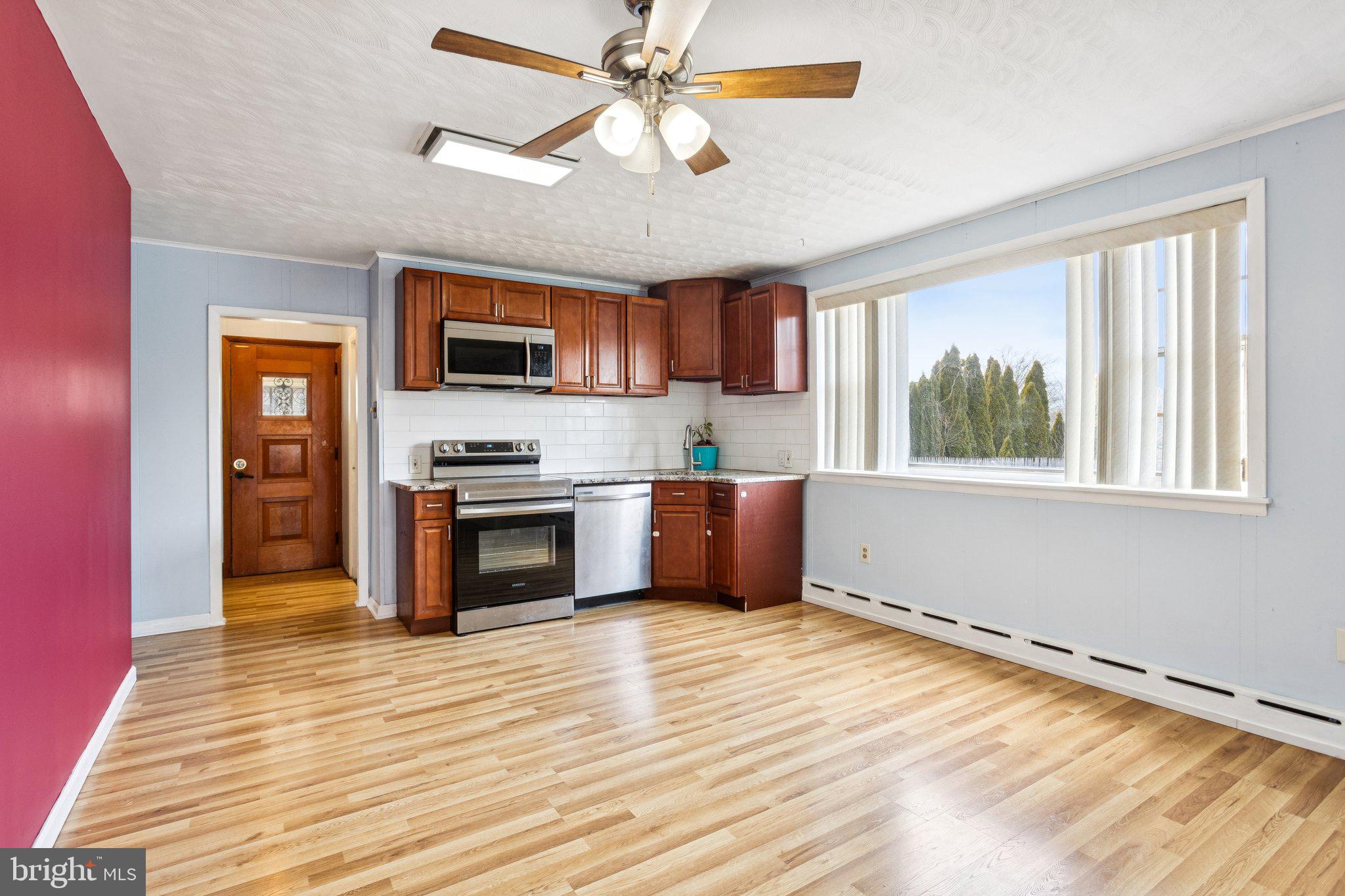 2614 Old Welsh Road Willow Grove, PA 19090 - Photo 31 of 47 a kitchen with granite countertop a stove and a microwave oven