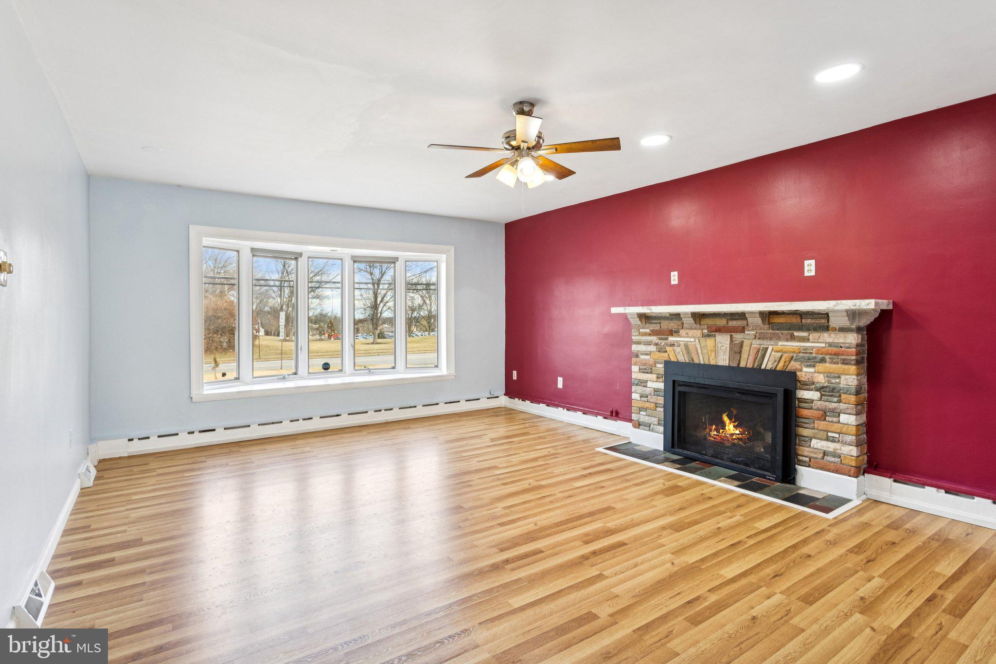 2614 Old Welsh Road Willow Grove, PA 19090 - Photo 4 of 47 a view of an empty room with a fireplace and a window