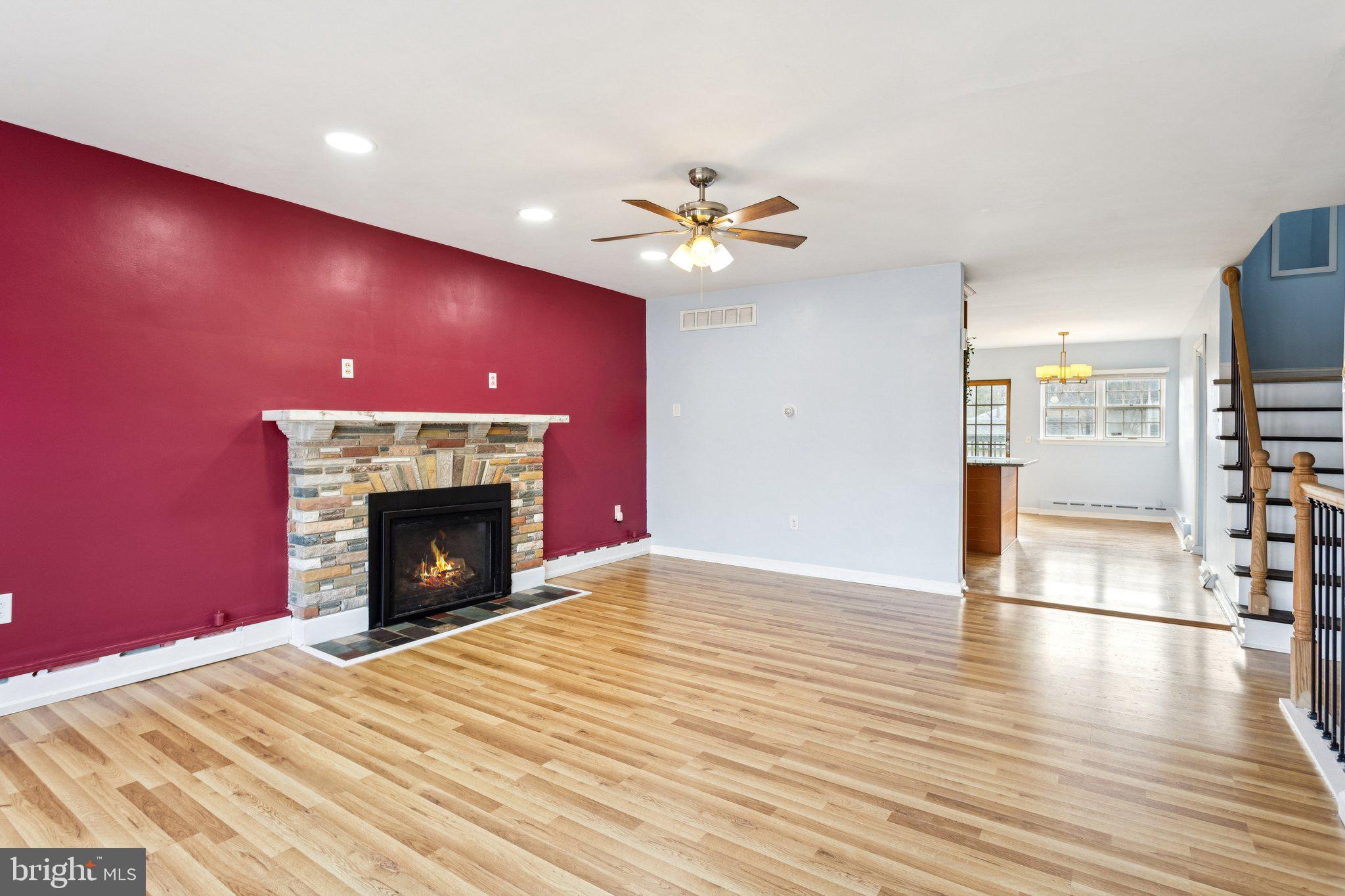 2614 Old Welsh Road Willow Grove, PA 19090 - Photo 5 of 47 a view of an empty room with a fireplace and a ceiling fan
