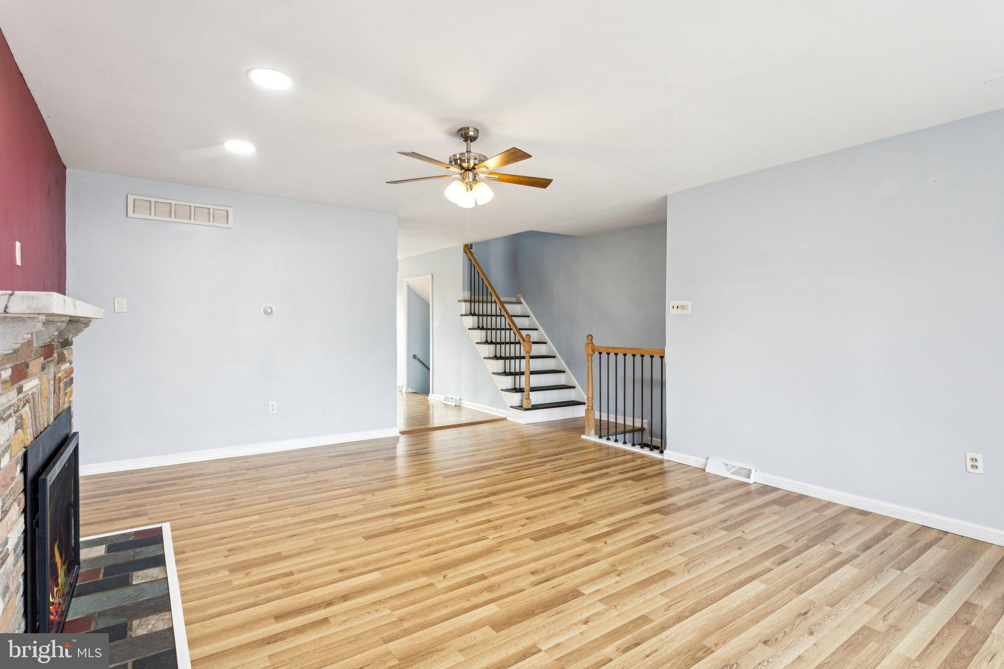 2614 Old Welsh Road Willow Grove, PA 19090 - Photo 6 of 47 a view of an empty room with wooden floor and a fireplace