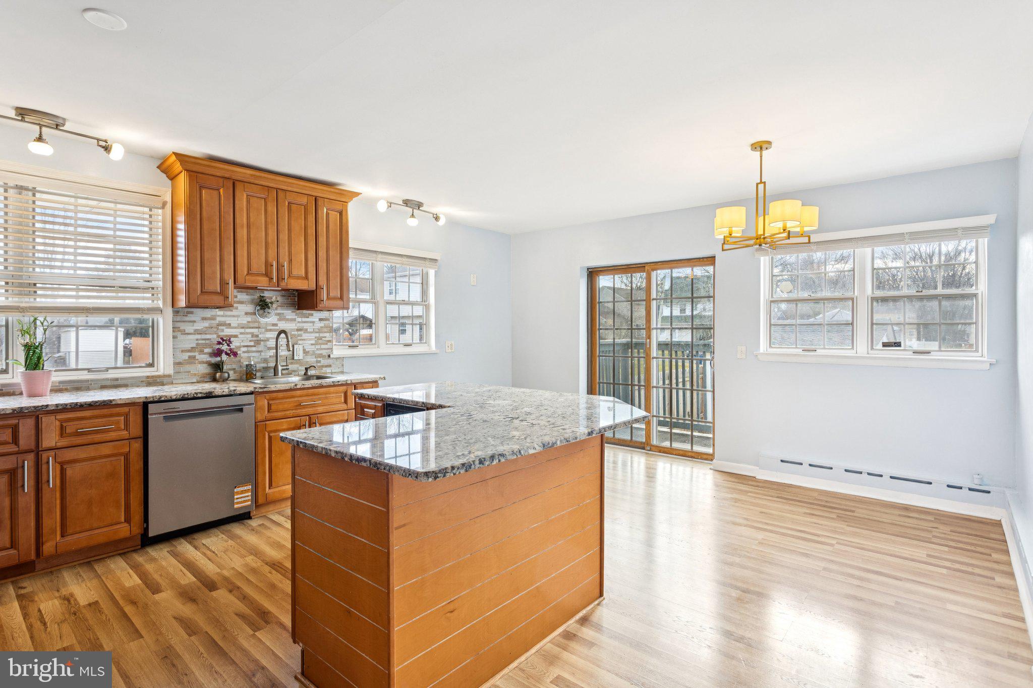 2614 Old Welsh Road Willow Grove, PA 19090 - Photo 7 of 47 a kitchen with stainless steel appliances granite countertop a sink stove and wooden cabinets