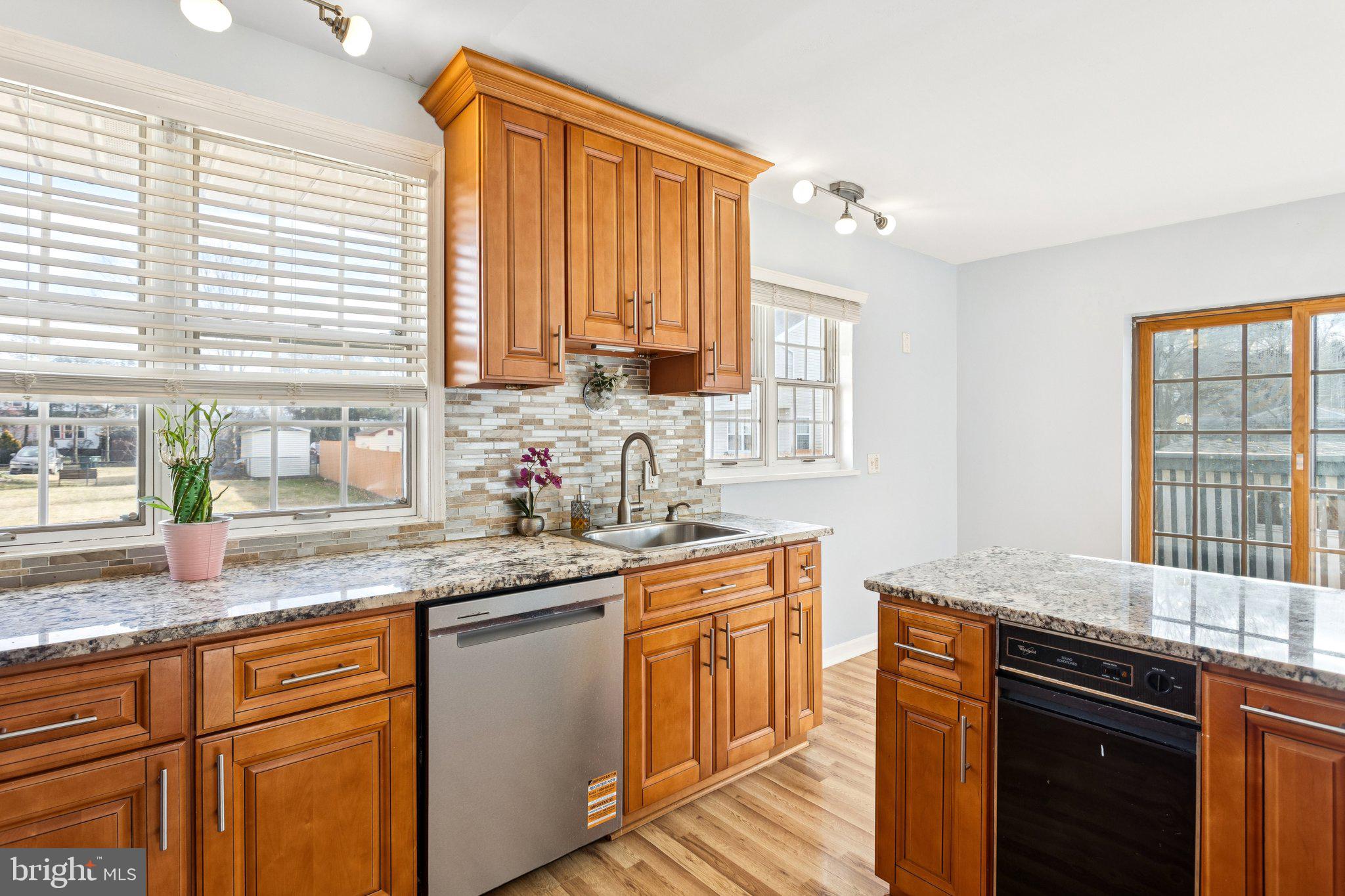 2614 Old Welsh Road Willow Grove, PA 19090 - Photo 9 of 47 a kitchen with stainless steel appliances granite countertop a sink a stove cabinets counter space and a window