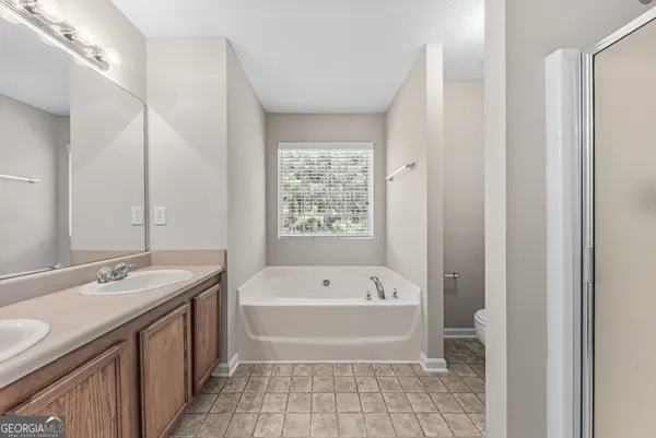 a bathroom with a bathtub and a sink