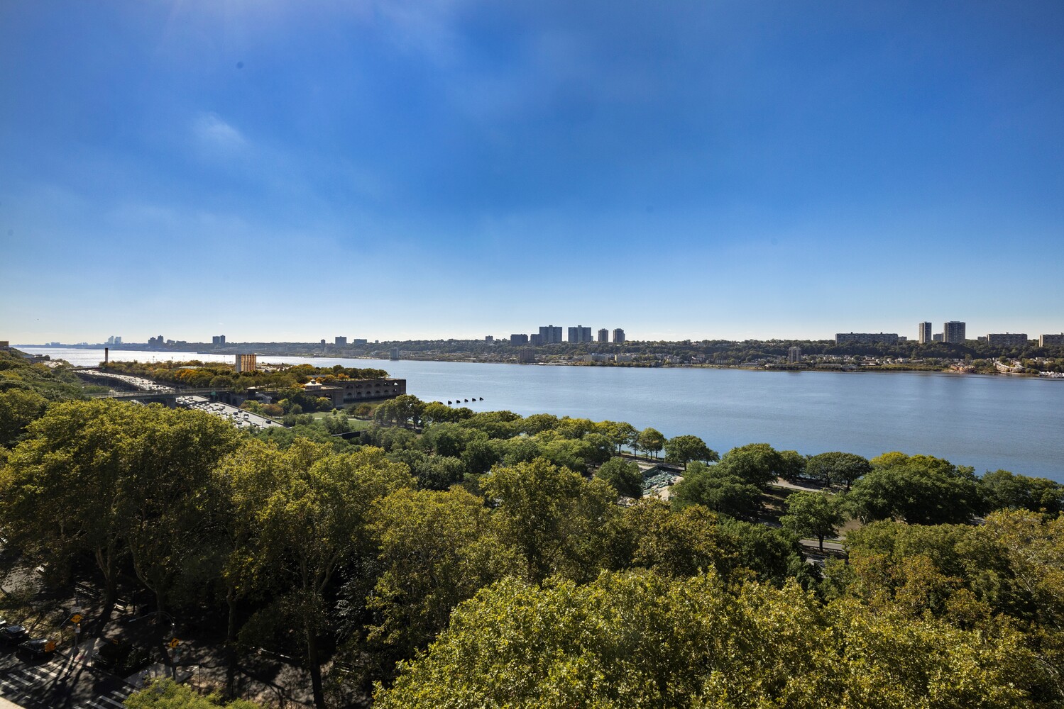 725 Riverside Drive, Unit 11A Manhattan, NY 10031 - Photo 12 of 21 a view of a lake with houses in the back