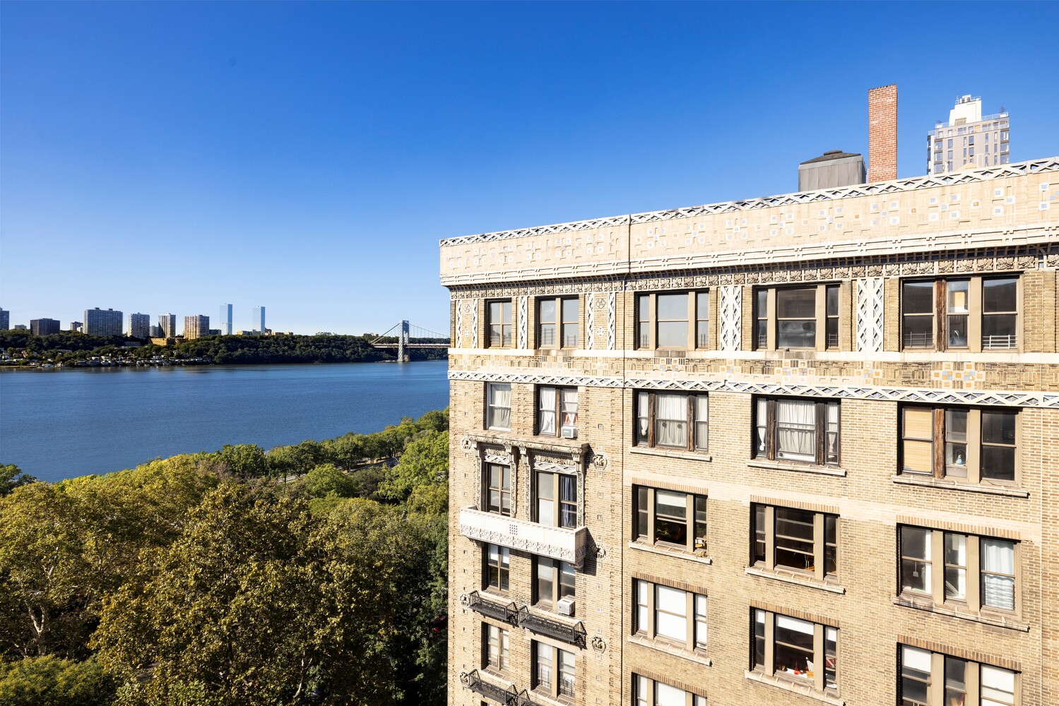 725 Riverside Drive, Unit 11A Manhattan, NY 10031 - Photo 3 of 21 a view of a lake with building in front of it