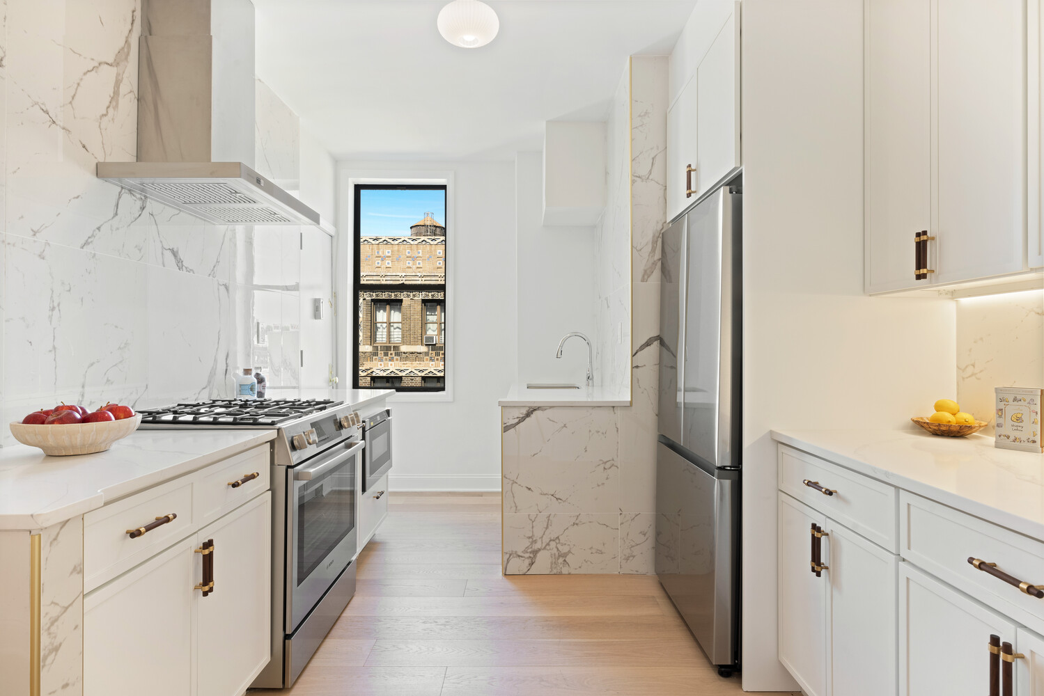 725 Riverside Drive, Unit 11A Manhattan, NY 10031 - Photo 6 of 21 a kitchen with stainless steel appliances a stove and a refrigerator