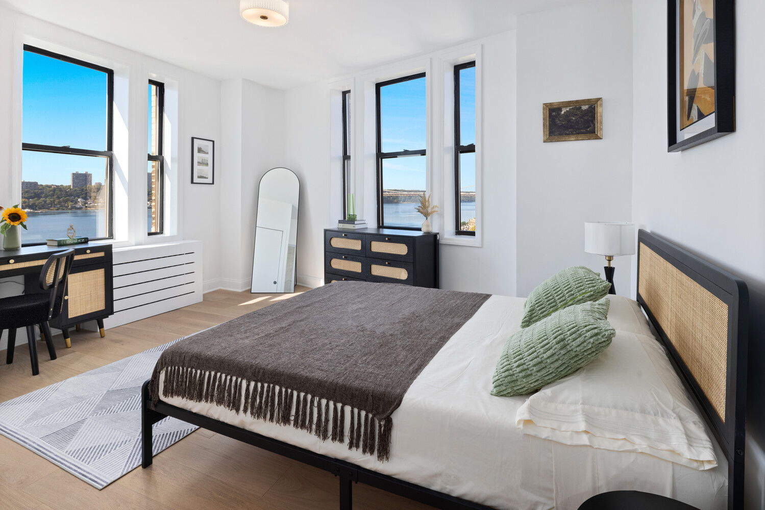 725 Riverside Drive, Unit 11A Manhattan, NY 10031 - Photo 7 of 21 a bedroom with a bed and a dresser with mirror