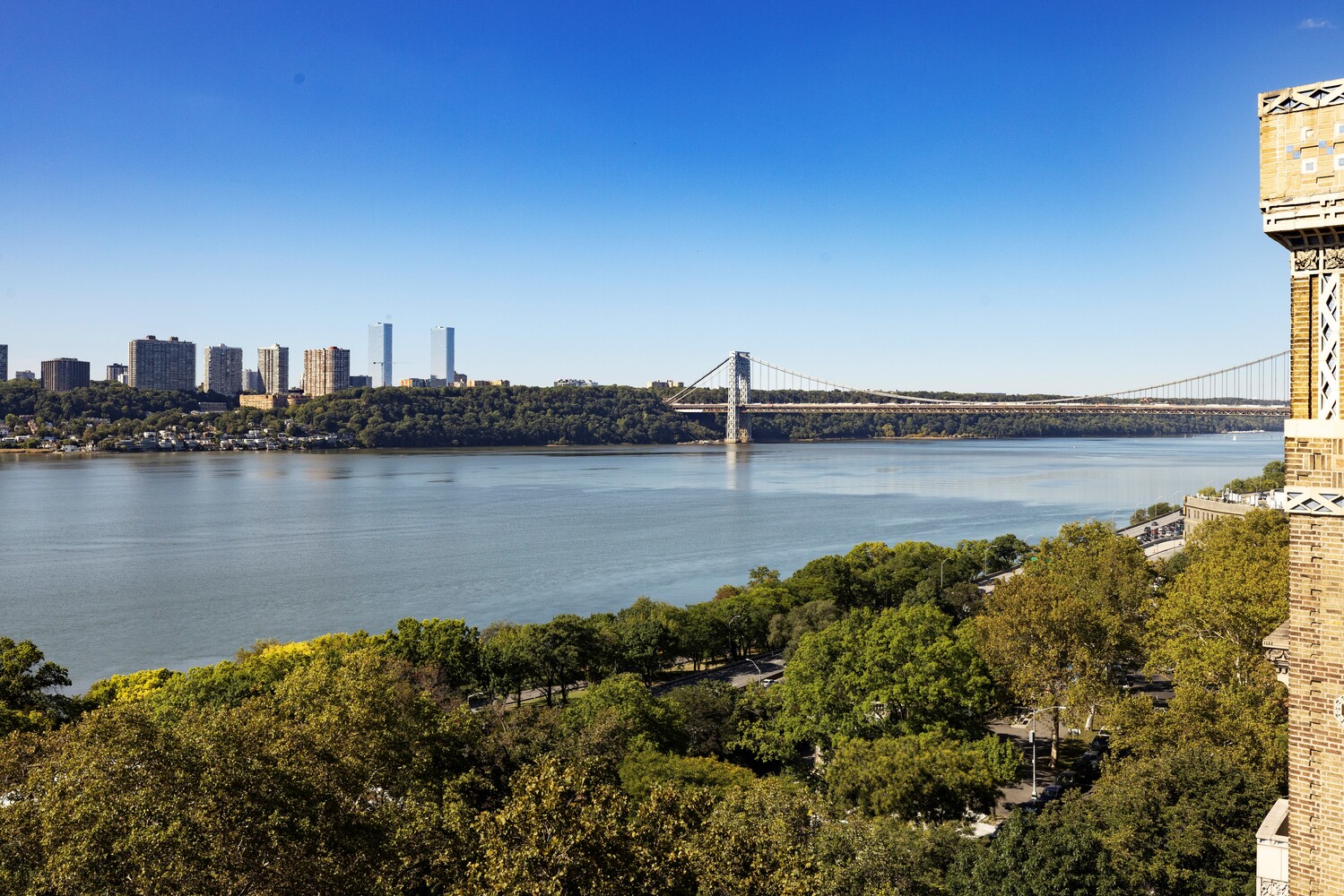 725 Riverside Drive, Unit 11A Manhattan, NY 10031 - Photo 8 of 21 a view of a lake with houses in the background