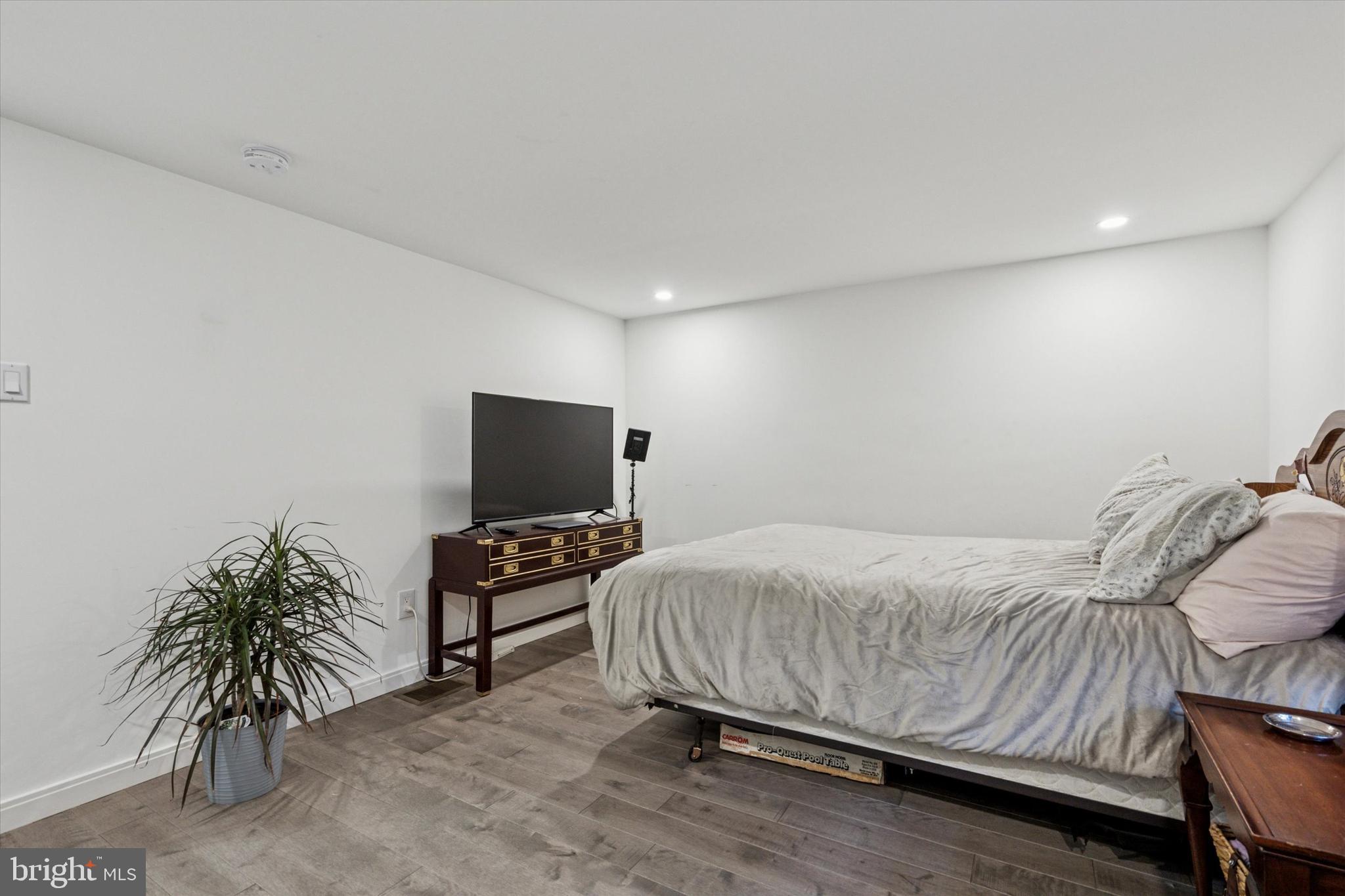 2694 Bridge Street Philadelphia, PA 19137 - Photo 32 of 41 a bedroom with a bed and a flat screen tv