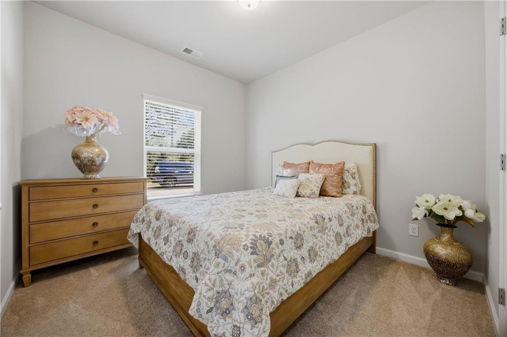 70 Gold Mine Road Grantville, GA 30220 - Photo 15 of 23 a bedroom with a bed and window
