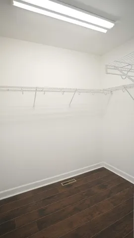 a view of a house with brick walls and potted plants