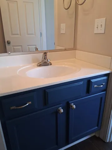 a view of swimming pool with house in the background