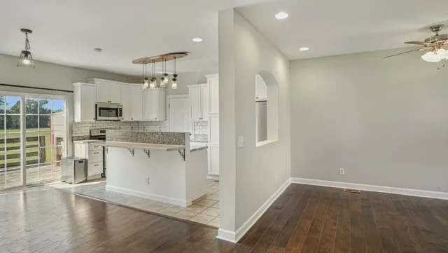 a view of a backyard with sitting area