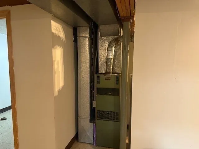a bathroom with a glass shower door and a mirror