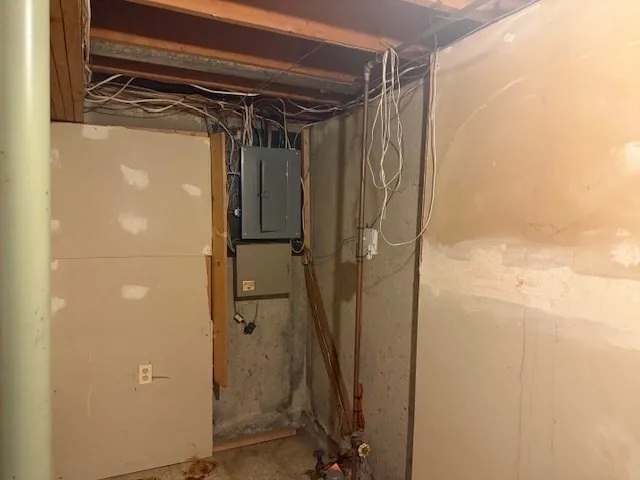 a view of a house with a wooden deck and furniture