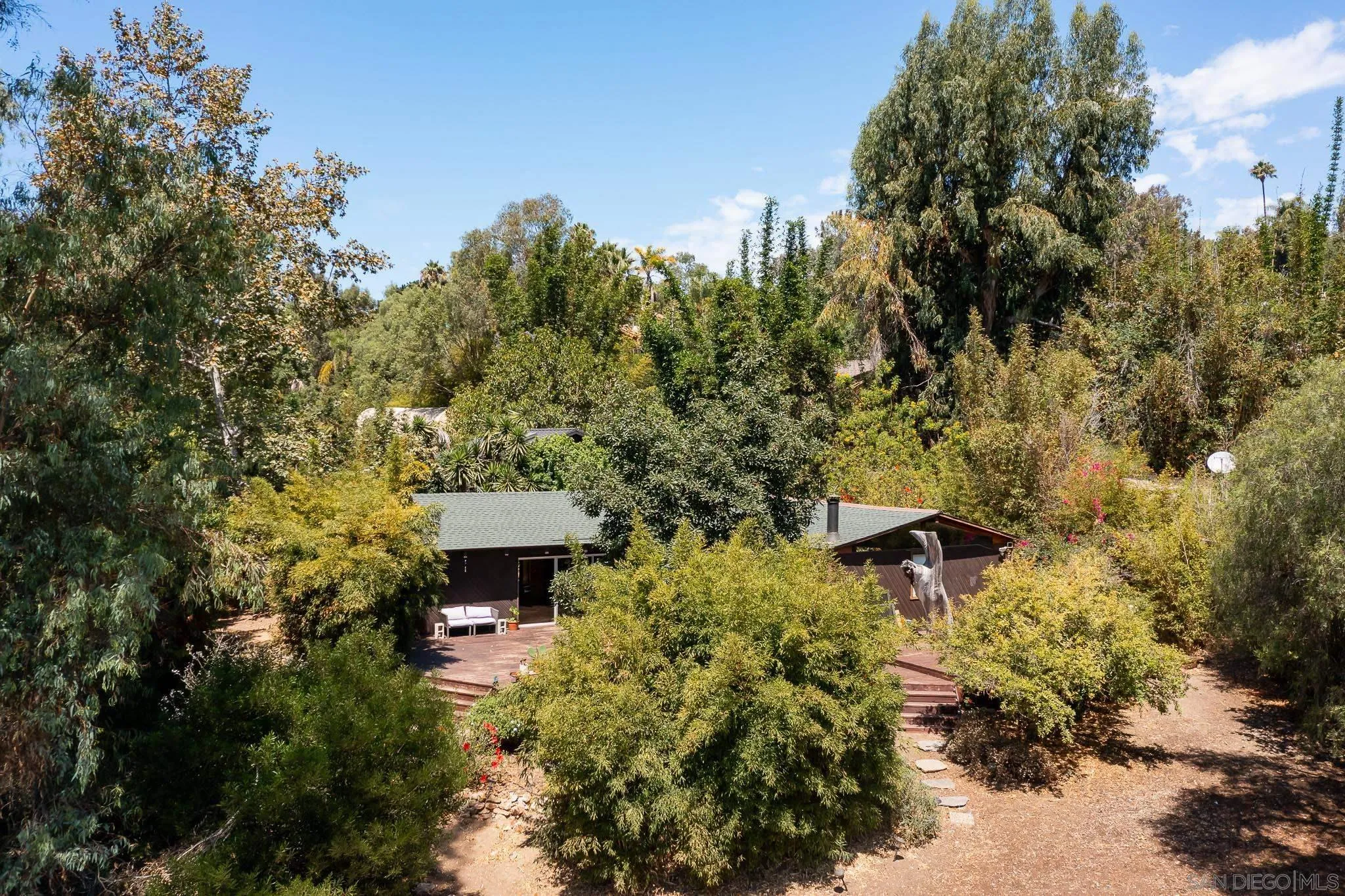 4880 Sun Valley Road Del Mar, CA 92014 - Photo 2 of 23 a view of a house with a yard and sitting area