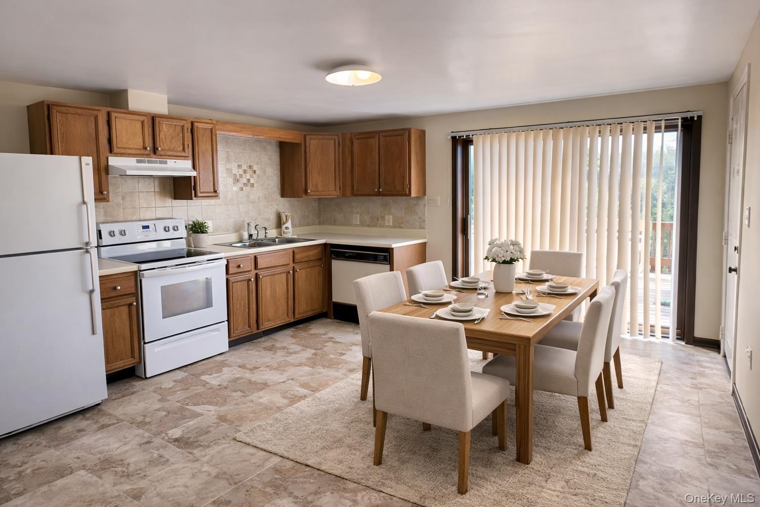69 Old Unionville Road, Unit 4 Wallkill, NY 12589 - Photo 4 of 21 Kitchen with white appliances, light countertops, and wood finish cabinets