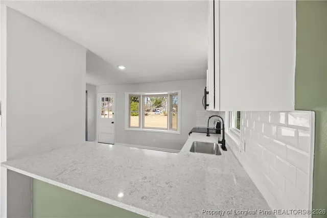 a room with a bed and a window