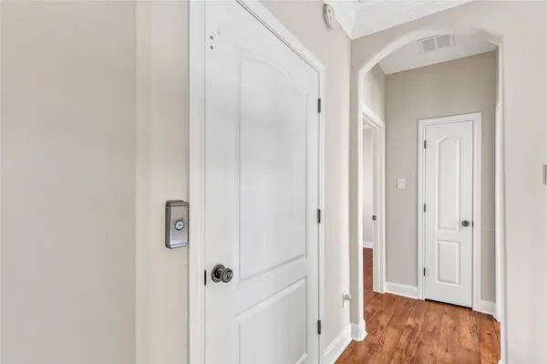 a view of a room with wooden floor