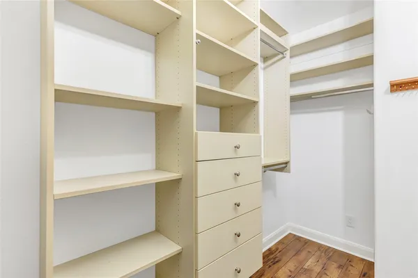 a view of an empty walk in closet