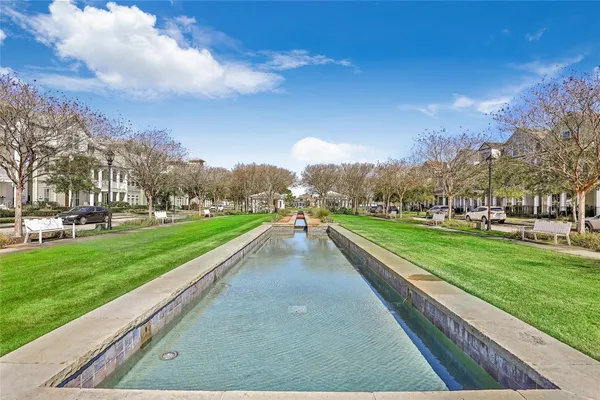 a view of a park with large trees