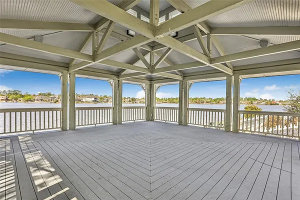 a view of a balcony with wooden floor