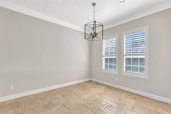 a view of empty room with windows