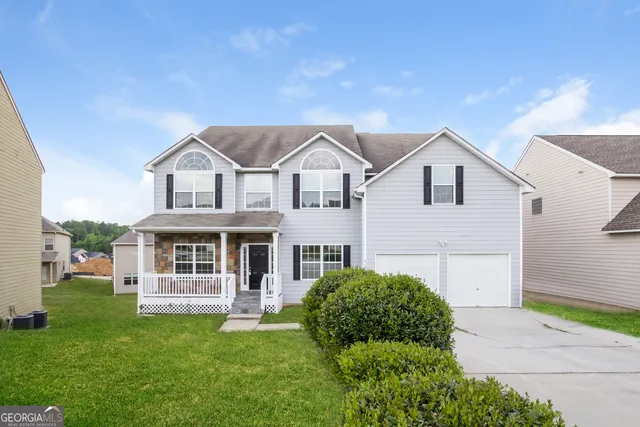 a house view with a garden space