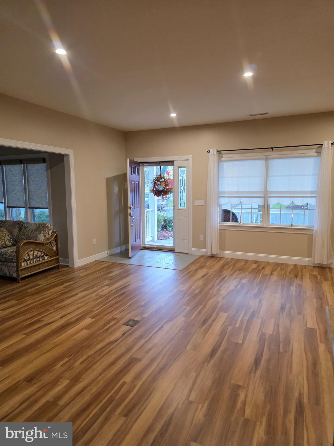 15 Bayberry Street Georgetown, DE 19947 - Photo 3 of 15 an empty room with wooden floor and windows